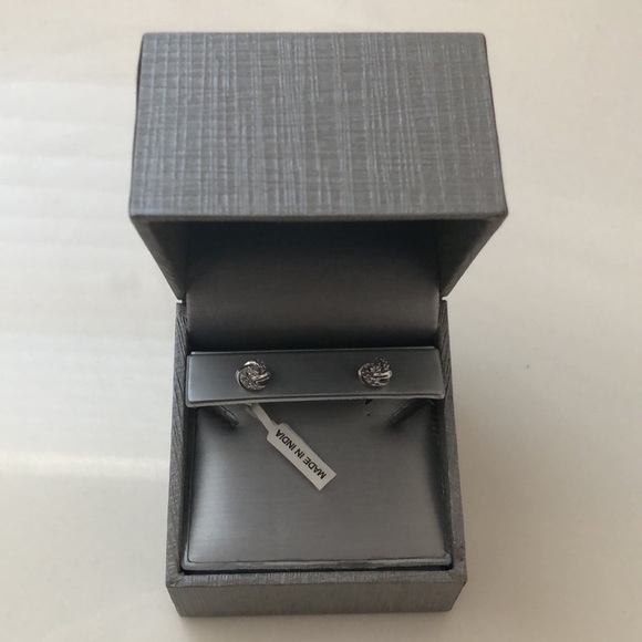 1/8 CT. T.W. Diamond Love Knot Stud Earrings in 20K White Gold - Picture 2 of 5